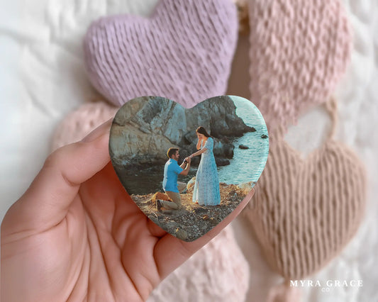 Heart-shaped custom engagement ceramic photo magnet on fridge – handmade personalized gift or Christmas fridge magnet. 