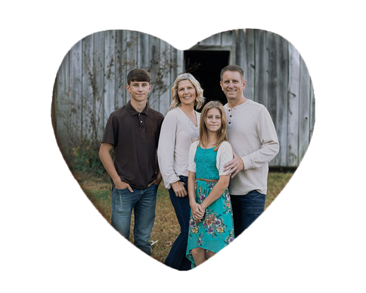 Heart-shaped custom family ceramic photo magnet on fridge – handmade personalized gift or Christmas fridge magnet. 